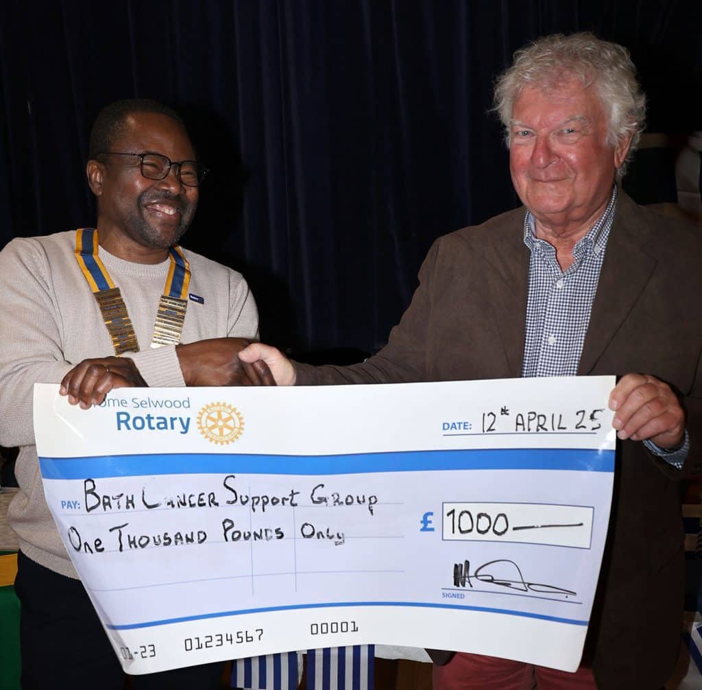 Rotarians raise funds for childrens charity and new Frome cancer unit L R Club President Patrick Otoide presenting the cheque to David Lane